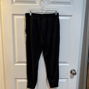 Vuori Women's Performance Joggers in black.